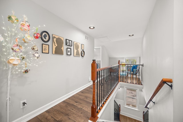 stairs with wood finished floors, baseboards, and recessed lighting