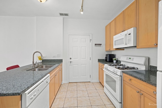 758 W 15th St Unit 3A, Chicago, IL 60607 - kitchen featuring white appliances, light tile patterned flooring, a sink, a peninsula, and dark stone counters