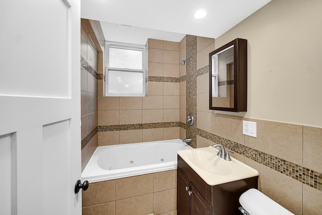 5656 S Dorchester Ave Unit B, Chicago, IL 60637 - full bathroom with vanity, a combined bath / shower with jetted tub, and tile walls