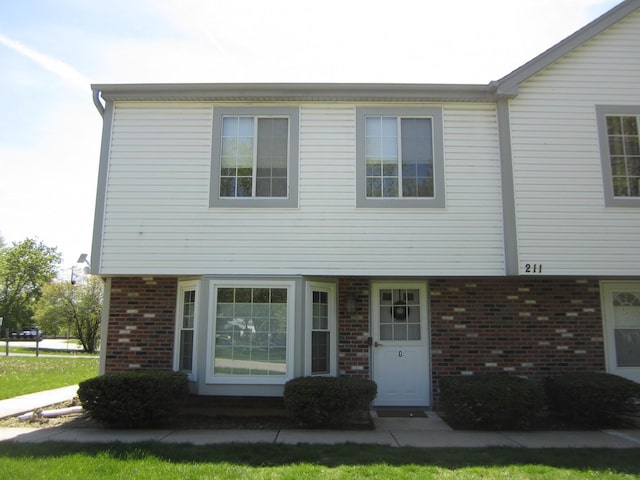 view of front of home featuring brick siding