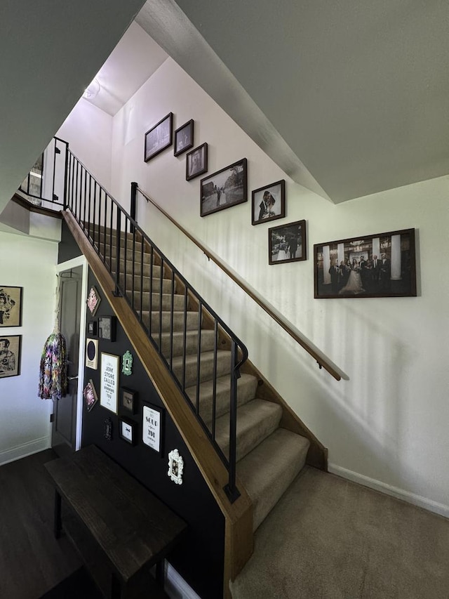 stairs with baseboards and wood finished floors