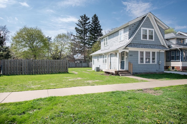 633 Watson St, Aurora, IL 60505 - view of front facade featuring central AC