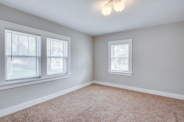 633 Watson St, Aurora, IL 60505 - carpeted spare room with baseboards