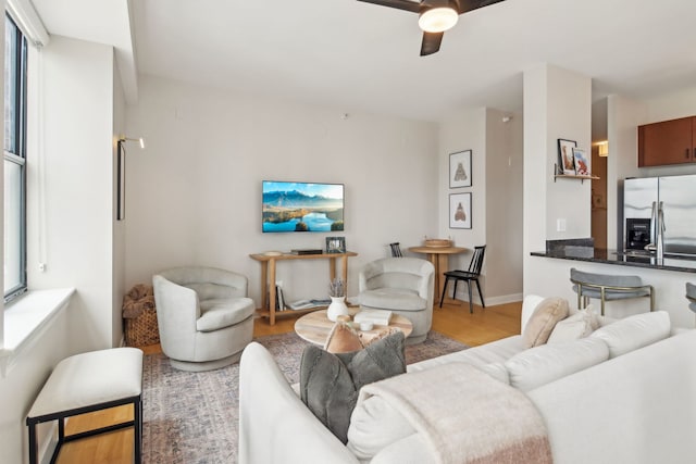 451 W Huron St Unit 1401, Chicago, IL 60654 - living room featuring wood finished floors, ceiling fan, healthy amount of natural light, and baseboards