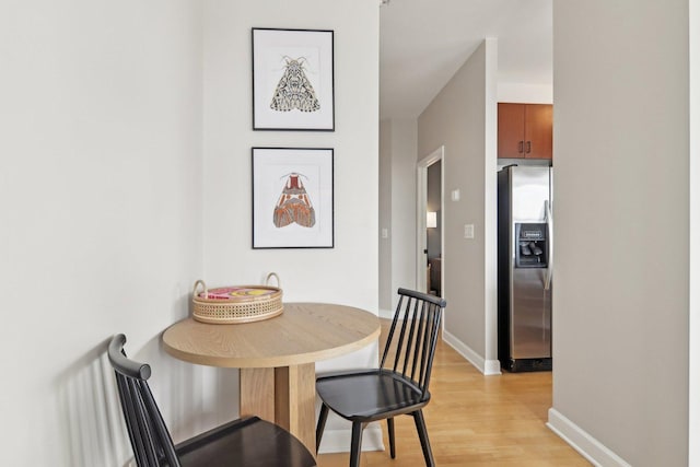 451 W Huron St Unit 1401, Chicago, IL 60654 - dining room with light wood-style flooring and baseboards