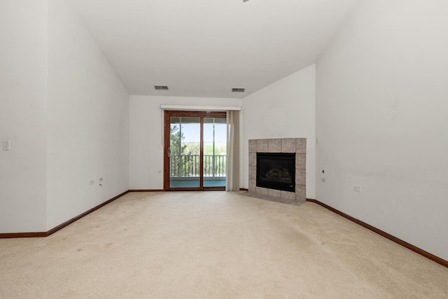 6248 Misty Pines Dr Unit 4, Tinley Park, IL 60477 - unfurnished living room with light carpet, a tiled fireplace, and baseboards
