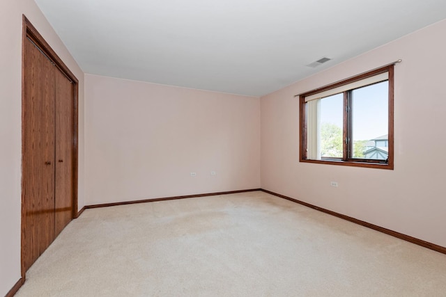 6248 Misty Pines Dr Unit 4, Tinley Park, IL 60477 - unfurnished bedroom featuring light carpet, baseboards, and a closet