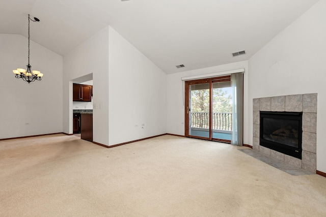 6248 Misty Pines Dr Unit 4, Tinley Park, IL 60477 - unfurnished living room featuring vaulted ceiling, a chandelier, light carpet, a tile fireplace, and baseboards