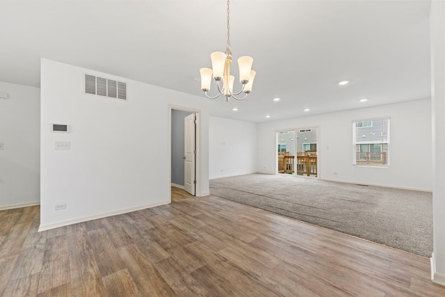 2344 Alison Ave, Pingree Grove, IL 60140 - unfurnished living room featuring a chandelier, wood finished floors, recessed lighting, and baseboards
