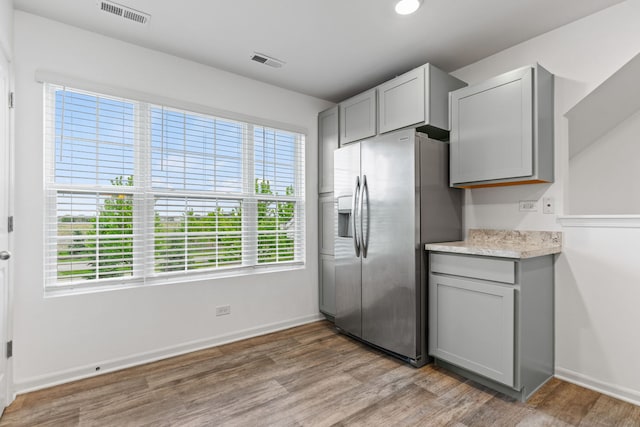 2344 Alison Ave, Pingree Grove, IL 60140 - kitchen with stainless steel fridge with ice dispenser, gray cabinets, light wood-style floors, and recessed lighting