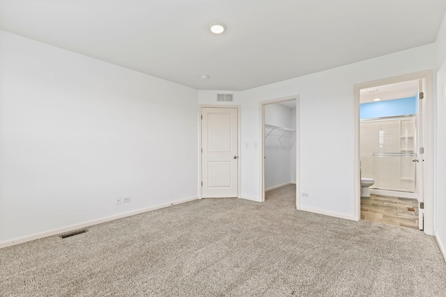 2344 Alison Ave, Pingree Grove, IL 60140 - unfurnished bedroom with carpet flooring, baseboards, a spacious closet, ensuite bath, and a closet