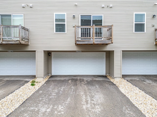 2344 Alison Ave, Pingree Grove, IL 60140 - back of property featuring a balcony, a garage, and driveway