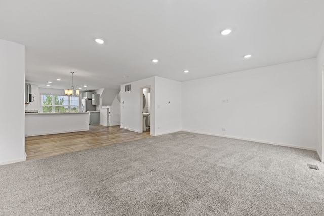 2344 Alison Ave, Pingree Grove, IL 60140 - unfurnished living room featuring carpet flooring, recessed lighting, baseboards, and a chandelier