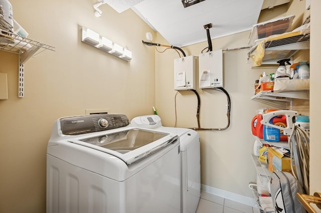132 E Delaware Pl Unit 4901, Chicago, IL 60611 - laundry area with independent washer and dryer and tile patterned flooring