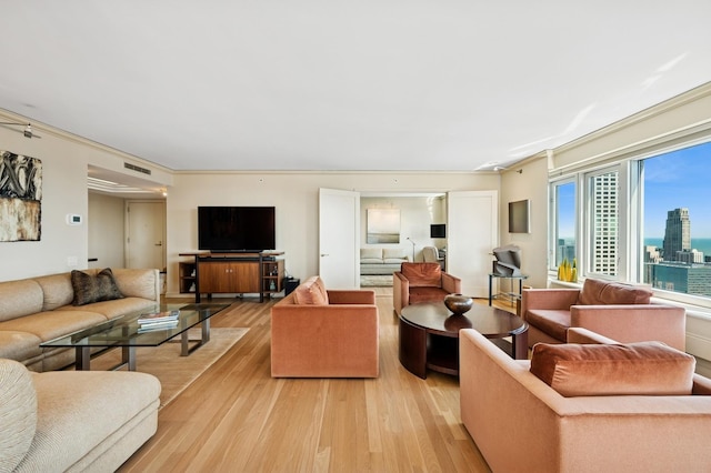 132 E Delaware Pl Unit 4901, Chicago, IL 60611 - living room with light wood-style floors and crown molding