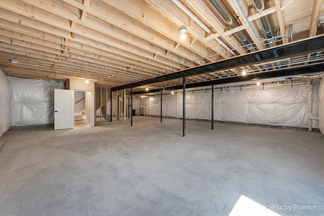 unfinished basement with stairs