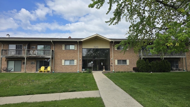 7410 Brookdale Dr Unit 214, Darien, IL 60561 - view of front of house featuring brick siding and a front yard