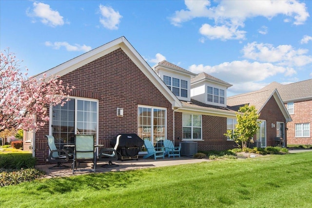 1147 Morgan St, Northbrook, IL 60062 - back of property with brick siding, a patio, and a yard