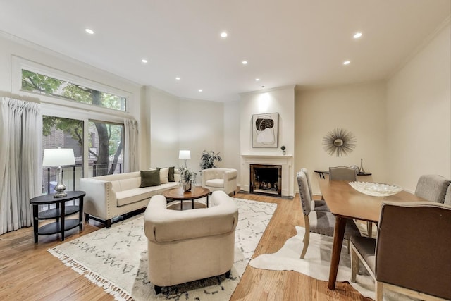 215 W Concord Ln, Chicago, IL 60614 - living room featuring recessed lighting, light wood finished floors, a fireplace, and crown molding