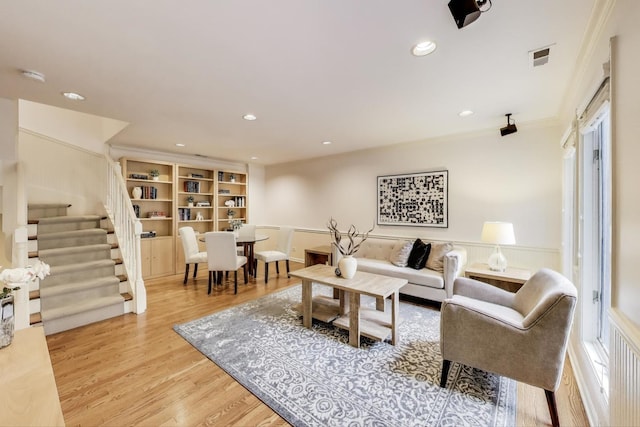 215 W Concord Ln, Chicago, IL 60614 - living area featuring recessed lighting, stairway, light wood finished floors, and crown molding