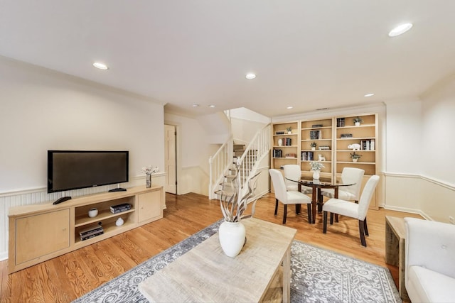 215 W Concord Ln, Chicago, IL 60614 - living area featuring stairs, light wood finished floors, recessed lighting, and wainscoting