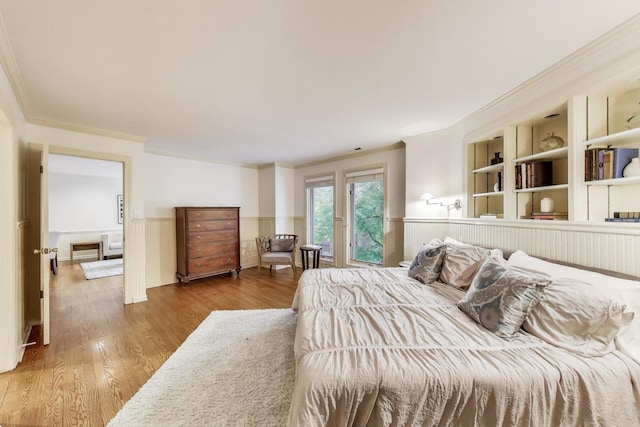 215 W Concord Ln, Chicago, IL 60614 - bedroom featuring crown molding, wainscoting, and wood finished floors