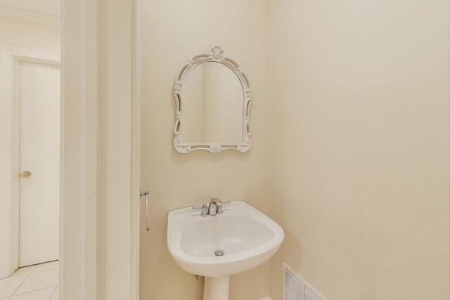 215 W Concord Ln, Chicago, IL 60614 - bathroom featuring a sink and tile patterned flooring