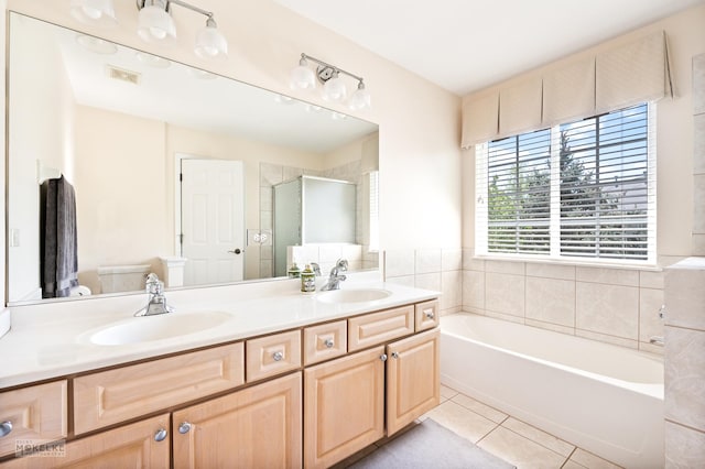 1254 Townes Cir, Aurora, IL 60502 - bathroom featuring tile patterned floors, a garden tub, double vanity, and a stall shower