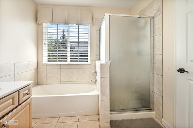 1254 Townes Cir, Aurora, IL 60502 - full bathroom featuring a shower stall, a garden tub, vanity, and tile patterned flooring