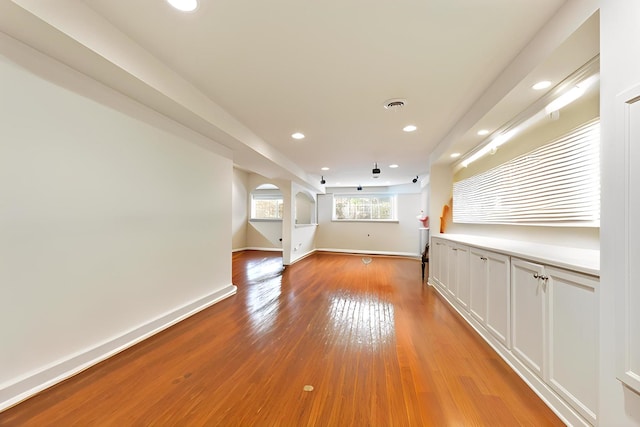 1254 Townes Cir, Aurora, IL 60502 - empty room featuring recessed lighting, light wood-style floors, and arched walkways