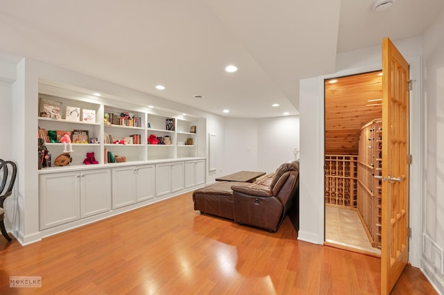 sitting room featuring light wood-style flooring and recessed lighting
