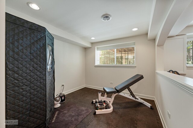exercise area featuring healthy amount of natural light, baseboards, and recessed lighting