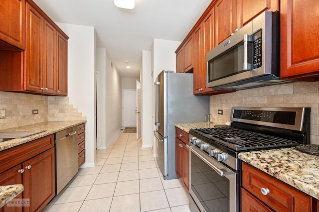 1254 Townes Cir, Aurora, IL 60502 - kitchen featuring stainless steel appliances, light tile patterned floors, light stone countertops, tasteful backsplash, and recessed lighting