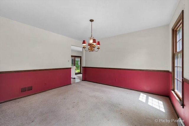 50 Southgate Crse, Saint Charles, IL 60174 - carpeted spare room featuring a chandelier and baseboards
