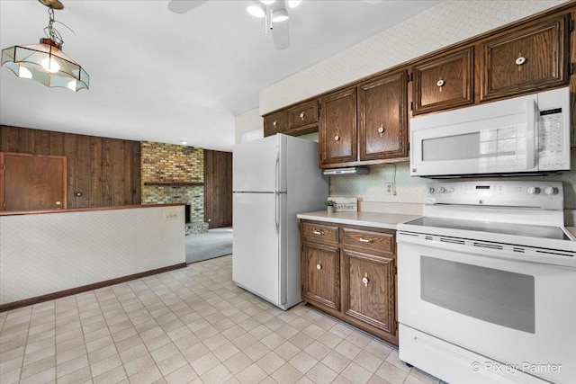 50 Southgate Crse, Saint Charles, IL 60174 - kitchen featuring white appliances, light countertops, ceiling fan, a brick fireplace, and wallpapered walls
