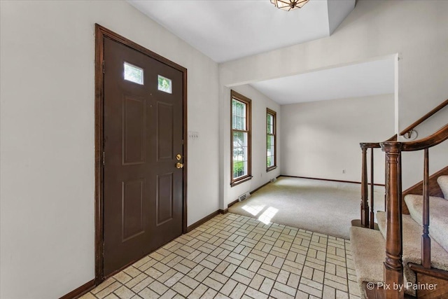 50 Southgate Crse, Saint Charles, IL 60174 - entrance foyer featuring baseboards, stairway, and brick patterned flooring