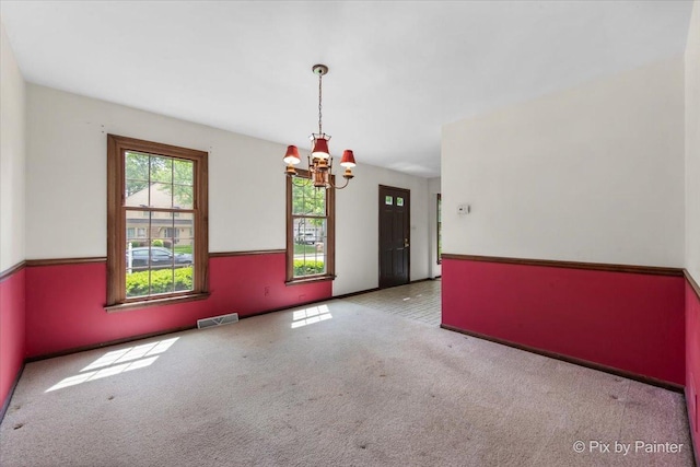 50 Southgate Crse, Saint Charles, IL 60174 - unfurnished room with a chandelier, carpet floors, and baseboards
