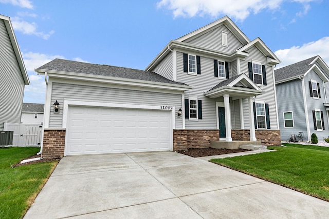 32009 Savannah Dr, Lakemoor, IL 60051 - craftsman inspired home with brick siding, driveway, and a garage