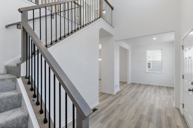 32009 Savannah Dr, Lakemoor, IL 60051 - stairs featuring wood finished floors, a high ceiling, and baseboards