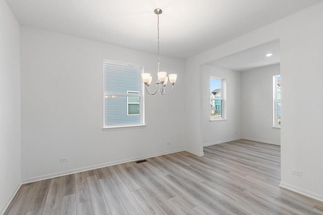 32009 Savannah Dr, Lakemoor, IL 60051 - unfurnished room featuring visible vents, recessed lighting, an inviting chandelier, baseboards, and light wood-style floors