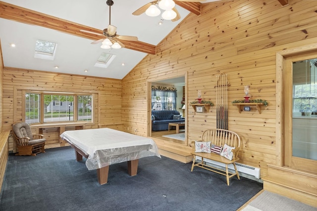 rec room with healthy amount of natural light, wood walls, dark carpet, ceiling fan, and recessed lighting