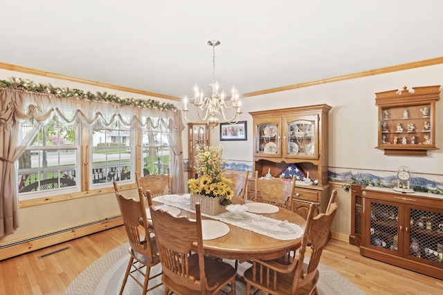 dining area featuring a baseboard radiator, a chandelier, ornamental molding, and light wood-style floors
