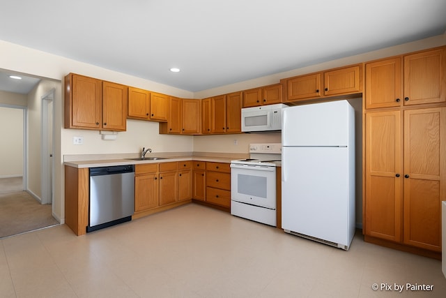 2221 W Nichols Rd Unit A, Arlington Heights, IL 60004 - kitchen featuring white appliances, a sink, light countertops, recessed lighting, and brown cabinetry