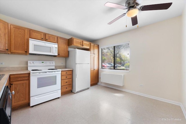 2221 W Nichols Rd Unit A, Arlington Heights, IL 60004 - kitchen featuring white appliances, light countertops, baseboards, ceiling fan, and brown cabinetry