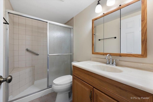 2221 W Nichols Rd Unit A, Arlington Heights, IL 60004 - full bathroom with a stall shower, toilet, vanity, and tile patterned flooring