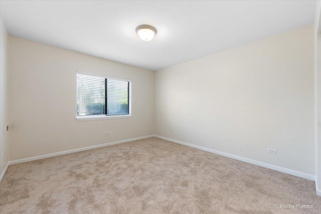 2221 W Nichols Rd Unit A, Arlington Heights, IL 60004 - empty room featuring carpet floors and baseboards