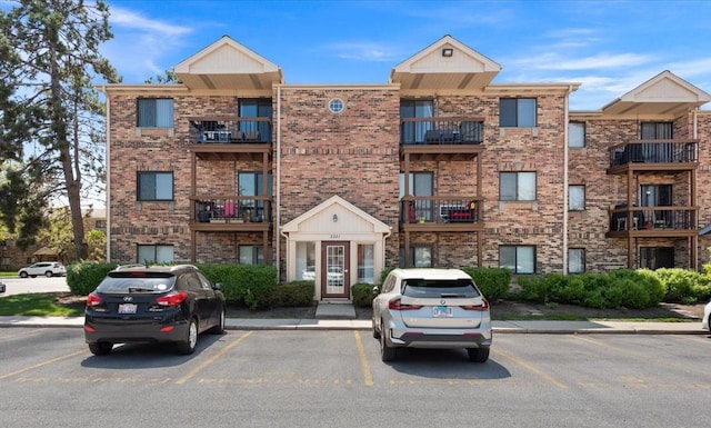 2221 W Nichols Rd Unit A, Arlington Heights, IL 60004 - view of apartment building / complex featuring uncovered parking