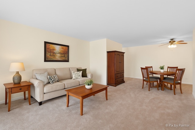 2221 W Nichols Rd Unit A, Arlington Heights, IL 60004 - living area with light carpet, ceiling fan, and baseboards