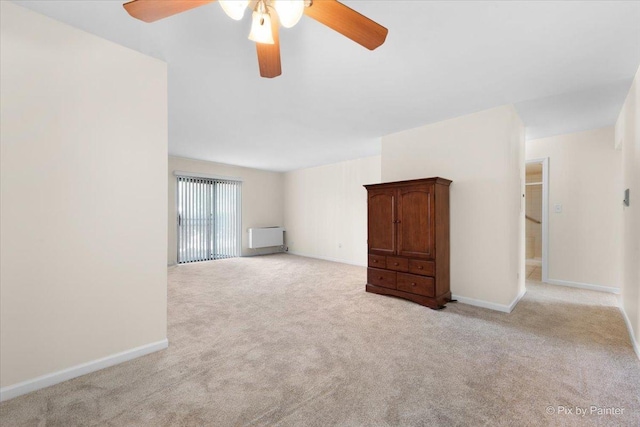 2221 W Nichols Rd Unit A, Arlington Heights, IL 60004 - empty room with light colored carpet, ceiling fan, and baseboards