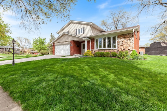15325 Walnut Rd, Oak Forest, IL 60452 - tri-level home with driveway, stone siding, a front yard, and a garage